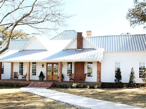 white house with silver metal roof|white house with galvalume roof.